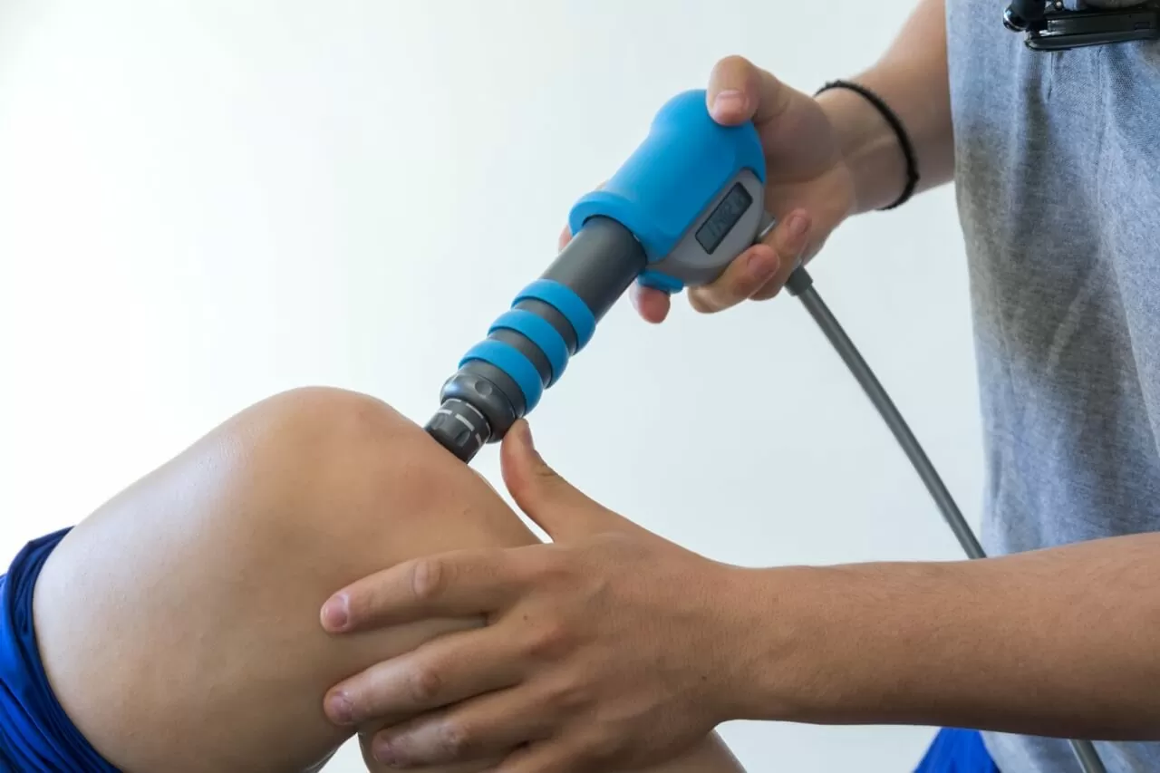 Shockwave therapy session with a physiotherapist